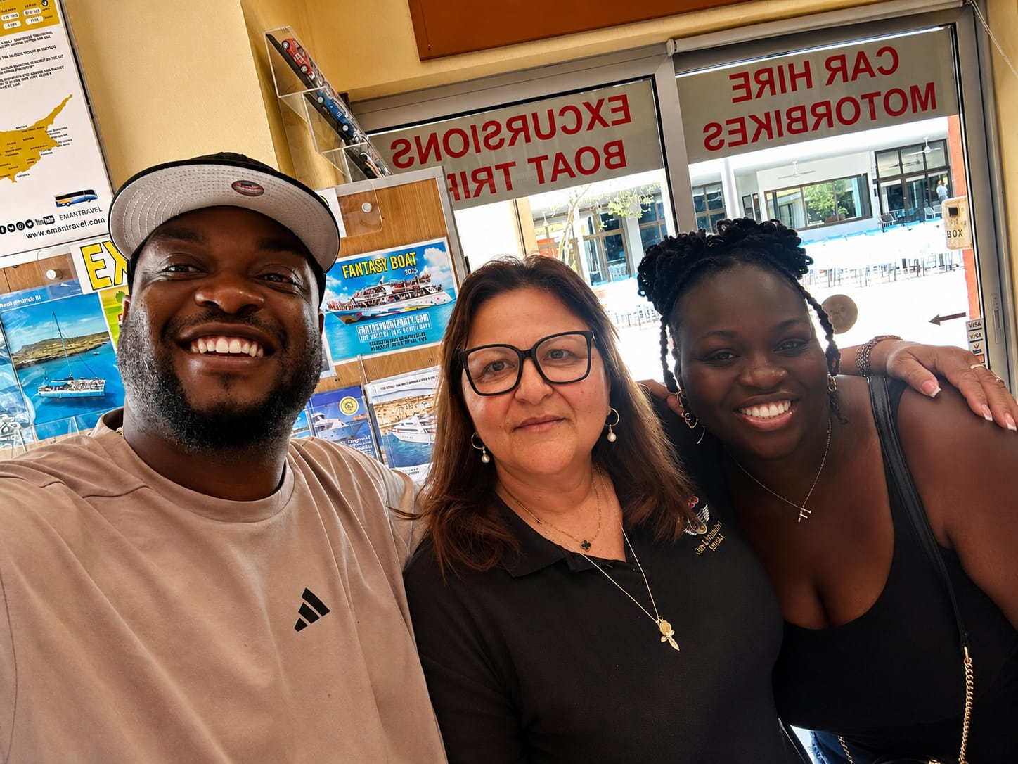 A team selfie with happy customers at the Kannias office